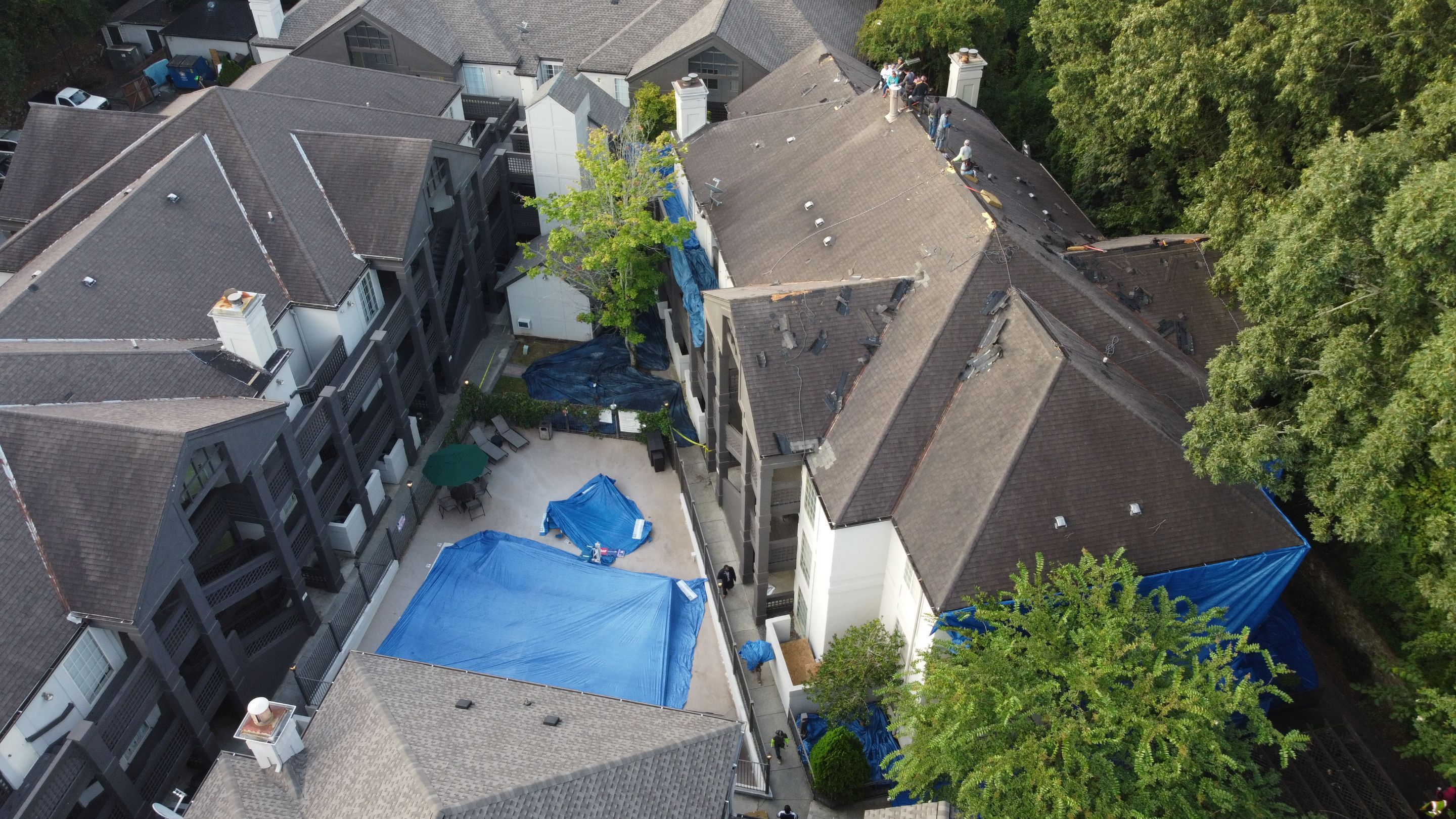 Roof replacement in progress showing new decking where radiant barrier sheathing installs
